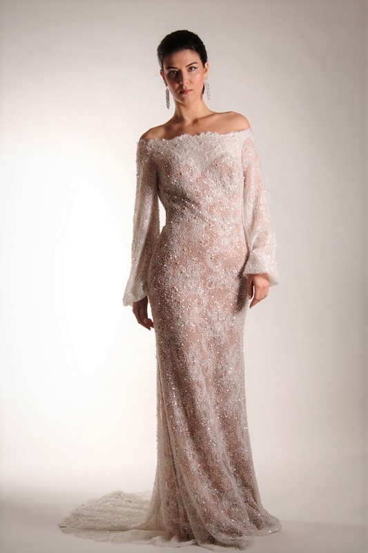 The cut of this bridal gown is designed to emphasize your height.