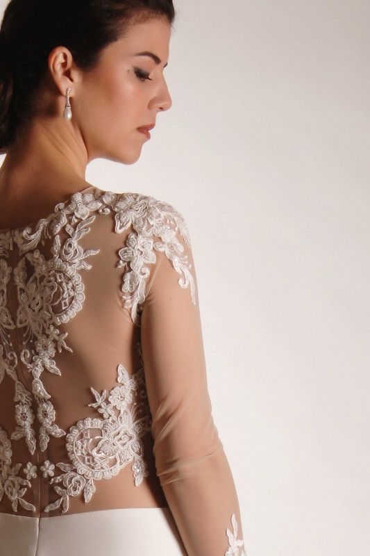 Dazzling lacework enhances the back of this bridal gown.